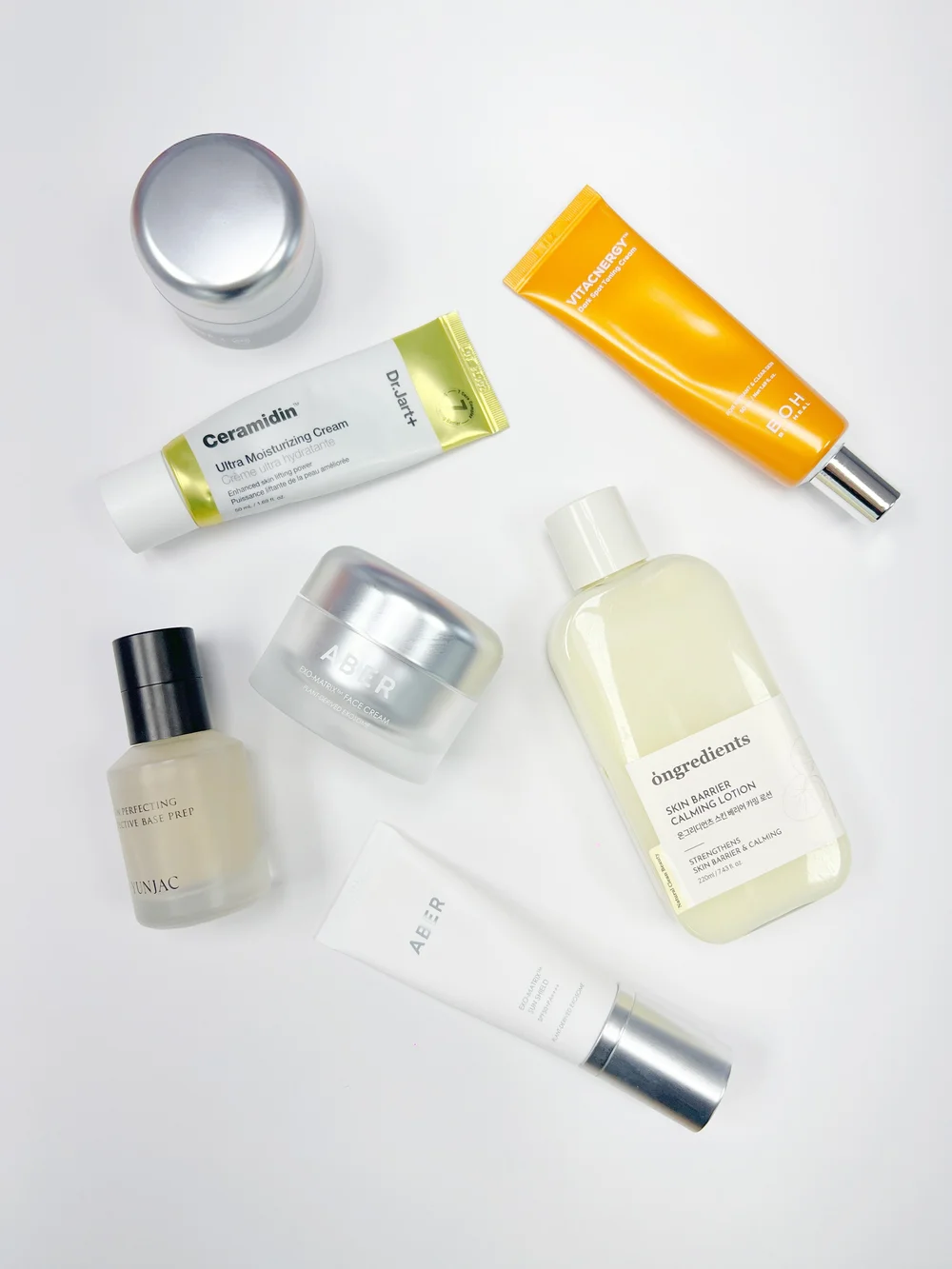 Korean cosmetic products arranged together, representing K-beauty skincare
